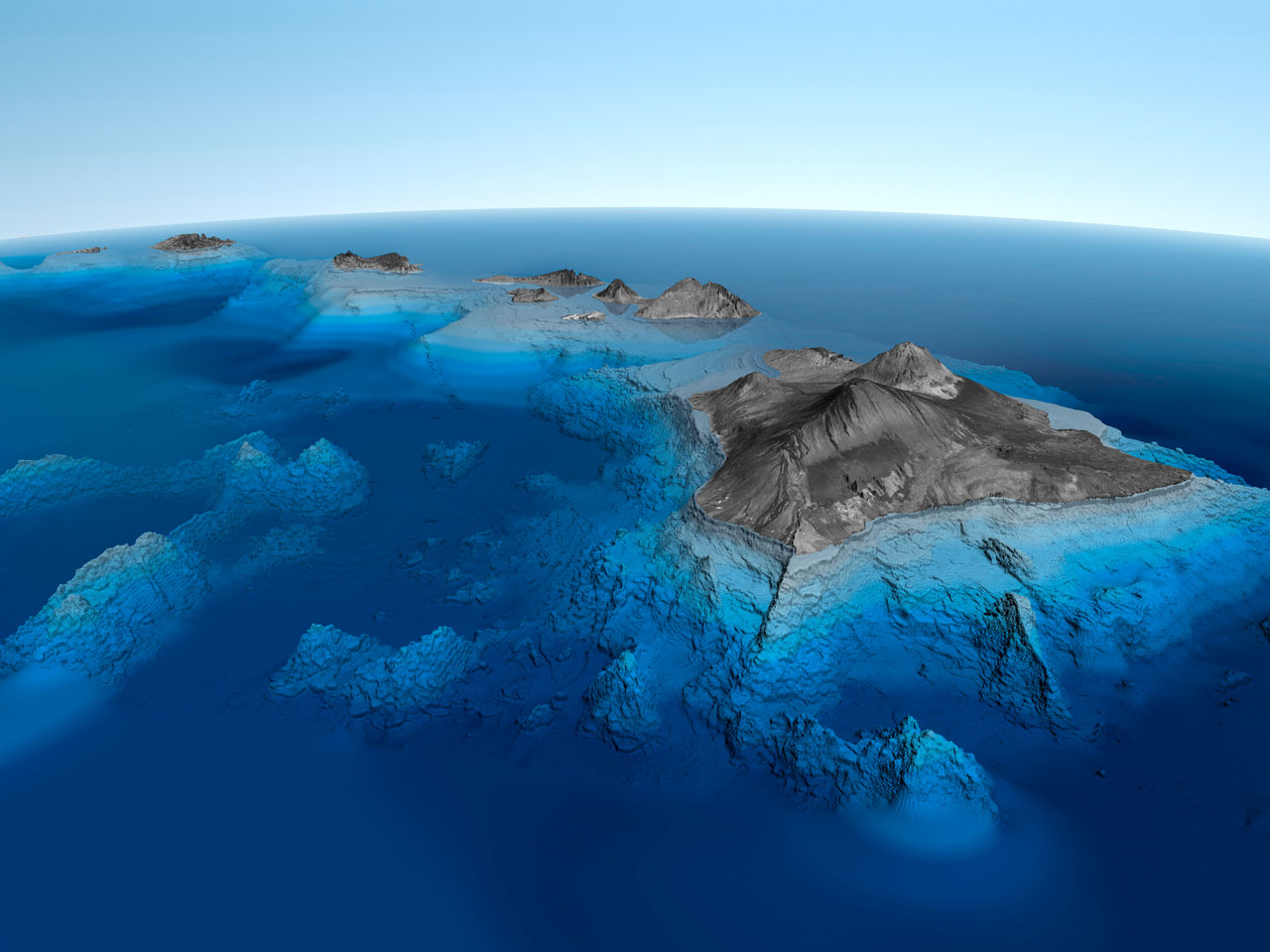 Stunning aerial view of Hawaiian volcanic islands surrounded by turquoise Pacific Ocean waters